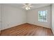 Light-filled bedroom featuring hardwood floors and a bright window at 4106 Chastain Park Ne Ct, Atlanta, GA 30342