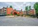 Exterior view of the building featuring red brick and balconies with visitor parking at 4106 Chastain Park Ne Ct, Atlanta, GA 30342