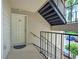 Apartment entrance featuring a staircase, a well-lit entryway, and a unit door at 4106 Chastain Park Ne Ct, Atlanta, GA 30342