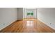 Inviting living room featuring hardwood floors, neutral walls, and a bright window at 4106 Chastain Park Ne Ct, Atlanta, GA 30342