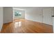 Cozy living room with hardwood floors, bright walls, and a window offering natural light at 4106 Chastain Park Ne Ct, Atlanta, GA 30342