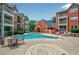 Inviting community pool surrounded by lounge chairs and well-maintained brick apartment buildings at 4106 Chastain Park Ne Ct, Atlanta, GA 30342