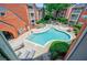 Overhead view of a community pool surrounded by brick buildings and lush landscaping at 4106 Chastain Park Ne Ct, Atlanta, GA 30342