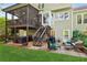 Beautiful backyard featuring a screened porch, patio seating, grill, and manicured lawn at 440 Laurian Nw Way, Kennesaw, GA 30144