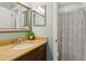 Bathroom featuring vanity with granite countertop and a framed mirror at 440 Laurian Nw Way, Kennesaw, GA 30144