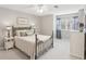 Bedroom with ceiling fan, neutral carpet, and white dresser next to a window with curtains at 440 Laurian Nw Way, Kennesaw, GA 30144