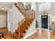Bright foyer boasting hardwood floors, elegant staircase, and a view of the front door at 440 Laurian Nw Way, Kennesaw, GA 30144