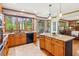 Charming kitchen with granite counters, hardwood floors, stainless appliances, and a view to the screened porch at 440 Laurian Nw Way, Kennesaw, GA 30144