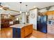 Well-equipped kitchen with island, stainless steel appliances, and seamless transition to the living room at 440 Laurian Nw Way, Kennesaw, GA 30144