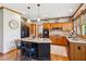 Charming kitchen with granite countertops, wooden cabinets, kitchen island and stainless steel appliances at 440 Laurian Nw Way, Kennesaw, GA 30144
