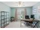 Bright home office with a large desk, shelves and comfortable seating is perfect for work or study at 440 Laurian Nw Way, Kennesaw, GA 30144