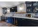 Finished basement bar with wood floors and a wine refrigerator at 4992 Concert Ln, Marietta, GA 30066