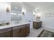 Dual sink bathroom with white countertops, dark wood cabinetry, and elegant gold accents at 4992 Concert Ln, Marietta, GA 30066