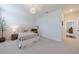 Bedroom featuring bright lighting, a white metal bed frame, and soft carpeting at 4992 Concert Ln, Marietta, GA 30066