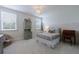 Charming bedroom with natural light and a decorative chandelier at 4992 Concert Ln, Marietta, GA 30066