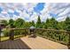Outdoor deck with a grill overlooking a private backyard with mature trees at 4992 Concert Ln, Marietta, GA 30066