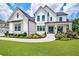 Stunning two-story home featuring a beautifully landscaped yard, covered porch, and classic white siding at 4992 Concert Ln, Marietta, GA 30066