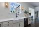 Bright kitchen with white cabinetry, stainless steel appliances, and a farmhouse sink at 4992 Concert Ln, Marietta, GA 30066