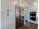 Modern kitchen with a stainless steel refrigerator and white cabinets at 4992 Concert Ln, Marietta, GA 30066