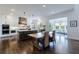 Bright kitchen with white cabinets, a center island, stainless steel appliances, and a dining area at 4992 Concert Ln, Marietta, GA 30066