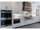 Modern kitchen with white cabinets, stainless steel appliances, and a marble countertop at 4992 Concert Ln, Marietta, GA 30066