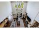 Open-concept living room with a soaring ceiling, exposed beams, and a modern chandelier at 4992 Concert Ln, Marietta, GA 30066