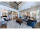 Spacious living room with hardwood floors, open floorplan, and a grand staircase to the second floor at 4992 Concert Ln, Marietta, GA 30066