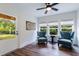 Bright sunroom with comfortable seating, natural light, and outdoor views at 4992 Concert Ln, Marietta, GA 30066