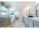 Spacious bathroom with double vanity, soaking tub, glass shower, and stylish decor at 5315 Trescott Path, Cumming, GA 30028