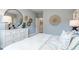Stylish bedroom featuring a dresser, mirror, and comfortable bed at 5315 Trescott Path, Cumming, GA 30028