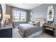 Bedroom with a queen-sized bed and natural light coming from a window at 5315 Trescott Path, Cumming, GA 30028