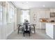 Cozy dining area with natural light, a modern table setting, and stylish decor at 5315 Trescott Path, Cumming, GA 30028
