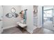 Hallway featuring a bench, mirrors, and an entryway to the laundry room at 5315 Trescott Path, Cumming, GA 30028