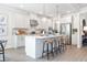 Spacious kitchen with an island, stainless steel appliances, and white cabinetry at 5315 Trescott Path, Cumming, GA 30028
