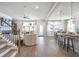 Bright, open-concept living area with stairs, breakfast bar, and natural light at 5315 Trescott Path, Cumming, GA 30028