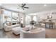 Open-concept living room and kitchen with modern furnishings and natural light at 5315 Trescott Path, Cumming, GA 30028