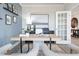 Comfortable home office with a large desk, plush chairs, and decor accents, offering a functional workspace at 5315 Trescott Path, Cumming, GA 30028