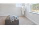Spacious walk-in closet with ottoman, bright window, hanging racks, and robe at 5315 Trescott Path, Cumming, GA 30028