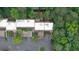 Detailed aerial view highlights the townhome with private outdoor space and lush tree coverage at 76 Forrest Pl, Atlanta, GA 30328