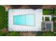 Aerial shot of a geometric swimming pool and surrounding landscaping, creating a relaxing outdoor oasis at 76 Forrest Pl, Atlanta, GA 30328