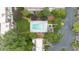 Aerial view of a sparkling community pool, surrounded by trees and lounge chairs for residents to enjoy at 76 Forrest Pl, Atlanta, GA 30328