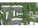 An overhead view captures a well-maintained townhome community with manicured landscaping and a sparkling pool at 76 Forrest Pl, Atlanta, GA 30328