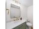 Tastefully updated bathroom featuring modern vanity, sink, mirror, and fixtures at 76 Forrest Pl, Atlanta, GA 30328