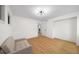 Bedroom with new flooring, modern light fixture and neutral paint at 76 Forrest Pl, Atlanta, GA 30328
