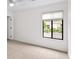 Carpeted bedroom with white walls and window at 76 Forrest Pl, Atlanta, GA 30328