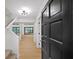 Bright foyer features light wood floors and staircase leading to the upper level of the home at 76 Forrest Pl, Atlanta, GA 30328
