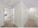 Neutral carpet hallway with views of rooms and lots of sunlight at 76 Forrest Pl, Atlanta, GA 30328