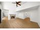 A spacious living room features a fireplace, vaulted ceilings and light, neutral flooring at 76 Forrest Pl, Atlanta, GA 30328