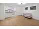 Open-concept living room with new floors and view to the modern kitchen at 76 Forrest Pl, Atlanta, GA 30328