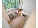 Open living space with fireplace, big windows, and wood flooring at 76 Forrest Pl, Atlanta, GA 30328